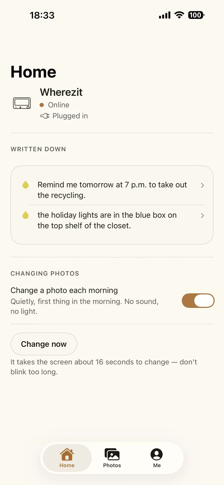 iPhone screenshot of the Wherezit app home screen: the household's saved notes listed, with a switch for changing the photo each morning.